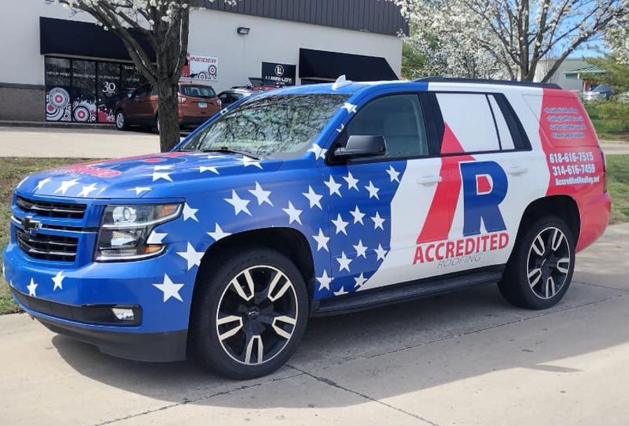 Accredited Roofing Service vehicle with American flag colors